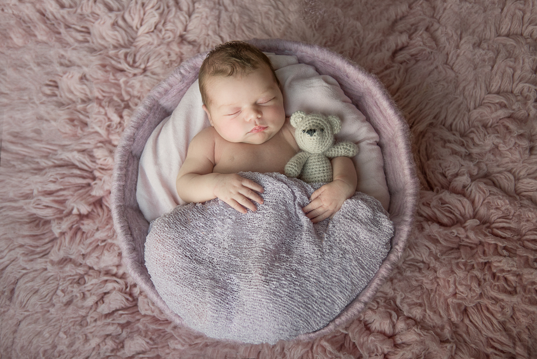 Newborn baby girl asleep during newborn session with Alison Armstrong