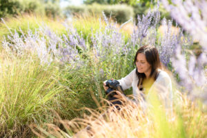 Photographer in lavender behind the scenes during branding session Norfolk