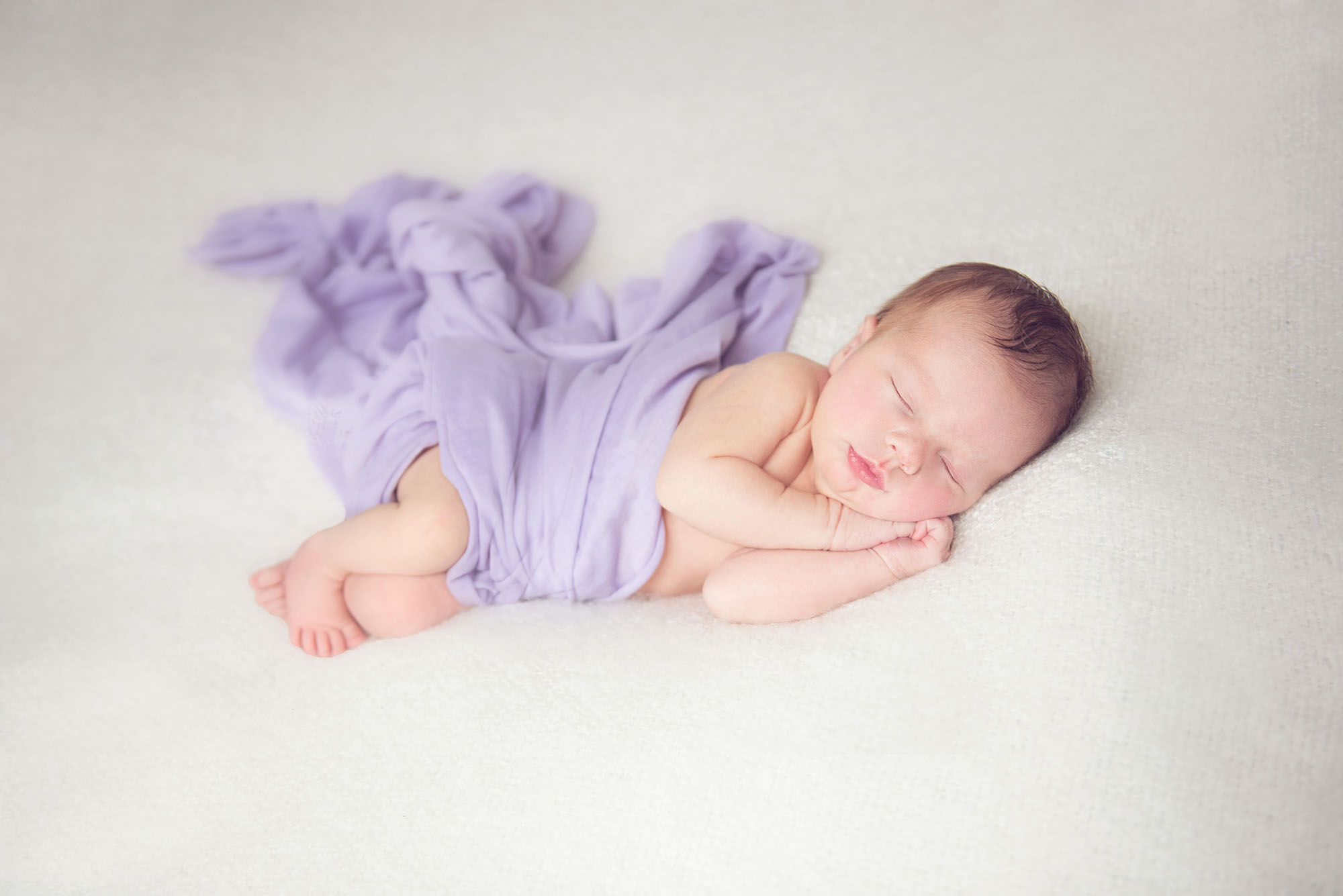 baby on beanbag at in home newborn photography session in norfolk
