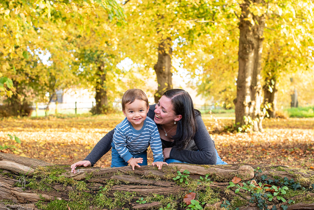 mum and son in forest during autumn photoshoot in norfolk